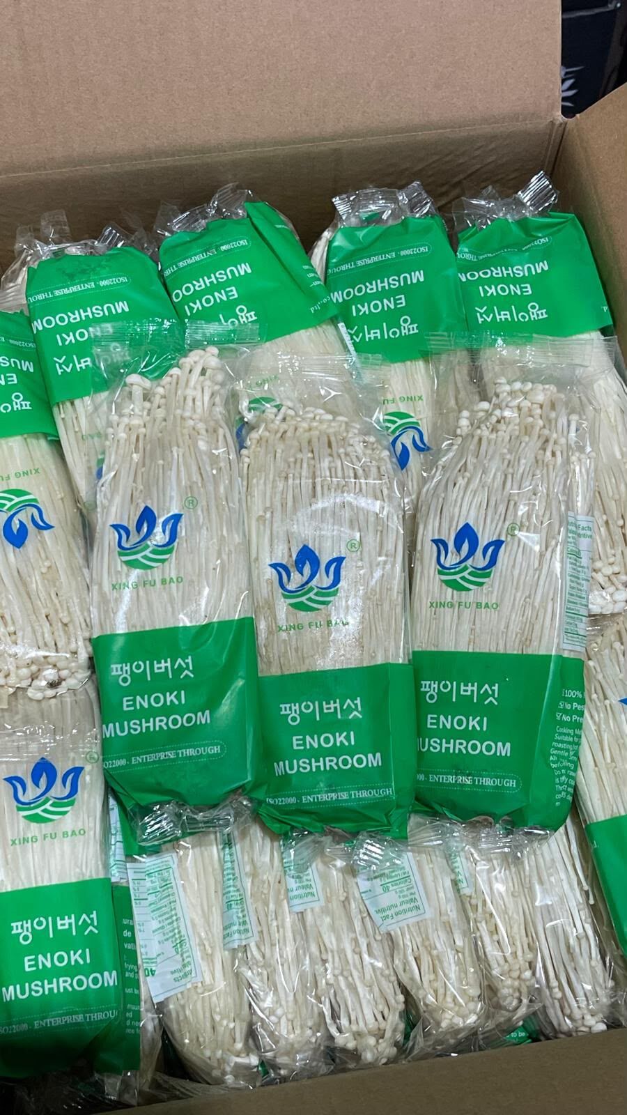 Packs of fresh enoki mushrooms